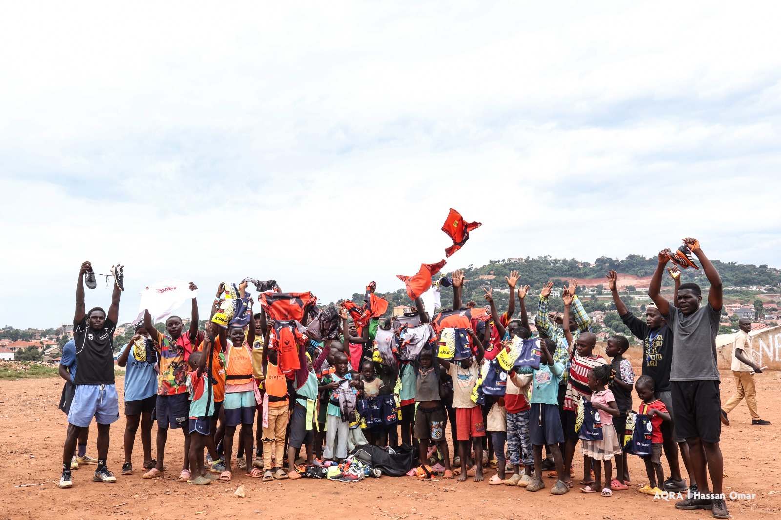 AQRA receive equipment from French Coach Kevin Thuillier while on Rugby tour in Uganda